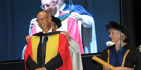 Wits alumnus Prof Keith Klugman receives an honorary doctorate at the Wits Health Sciences graduation ceremony December 2023